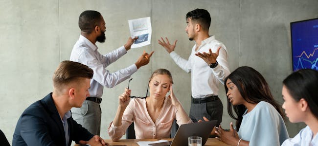 Workplace Conflicts. Stressed Group Of Business People Having Disagreements During Corporate Meeting